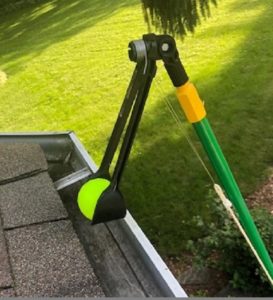 Gutter Sense tool grabbing tennis ball